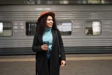 woman standign before train