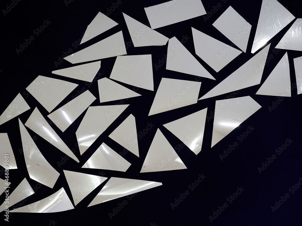 Poster texture or background of mirrored polygons on a black background