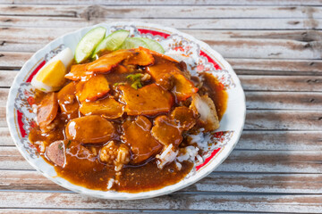 Barbecued red pork in sauce with rice