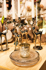 gold candlestick in the shape of a deer. Christmas collection of candlesticks. New Year's decor on the festive table. christmas candlestick collection