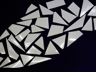 Texture or background of mirrored polygons on a black background