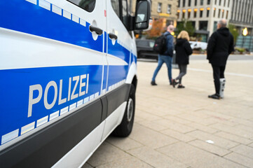 German police cars on the street. Side view of a police car with the lettering 