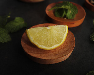 lemon slice on a wooden plate