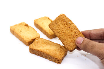 Crispy rusk on white background with selective focus