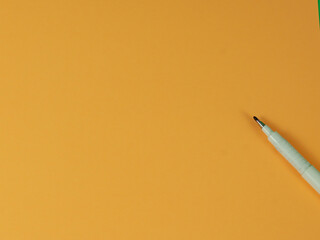 opening pen on yellow background