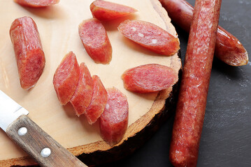Chinese sausage sliced, Chinese Pork Sausages for cooking on wood cutting board.