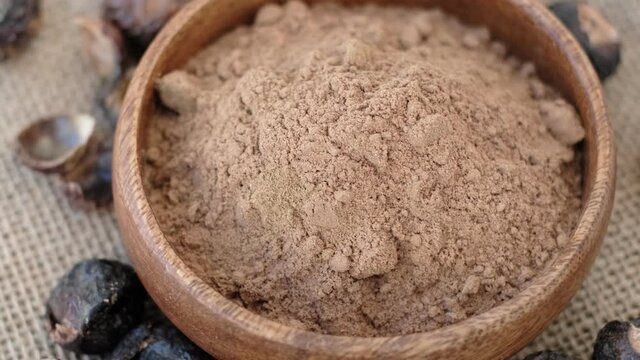 pile of ground soap nut powder for ecological washing. The raw fruit arita or rita, also known as soap nuts, is the main ingredient in any soap and shampoo.