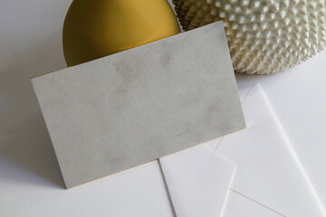 white envelope on top of white background with golden background objects