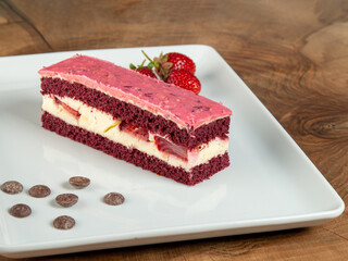 strawberry cake on white plate on wood