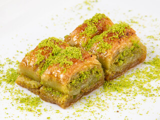 Turkish desert baklava with peanut, havuç dilim, midye, sarma, ramadan on the white plate turkish tasty