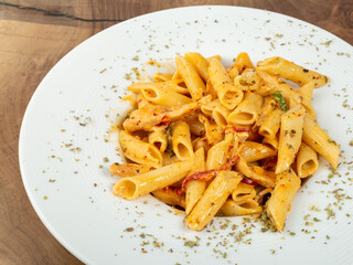 italian pasta white plate wood background