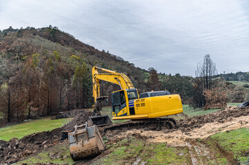 Industrial construction, clearing of the territory for construction by the excavator.