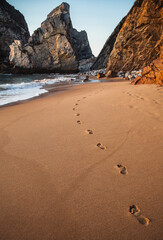 Footprints from vacationers on Ursa beach, Portugal
