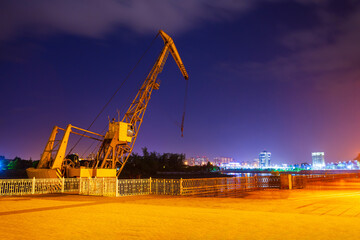 Fototapeta na wymiar Port crane at Kuban river, Krasnodar