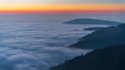 Fototapeta premium Sunset over a sea of clouds in the Black Forest