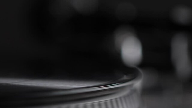 DJ headshell on spinning record on turntable. Listening the music