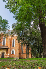 Fototapeta na wymiar DROHOBYCH, UKRAINE - May 25, 2021: The Roman Catholic church of St. Bartholomew with Defense tower.