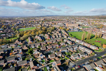 Aerial view of traditional housing estate in England. Looking down birds eye, like a miniature village. Estate agent. - obrazy, fototapety, plakaty