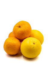 Ripe tangerines and oranges on a white background. Close-up. Story format