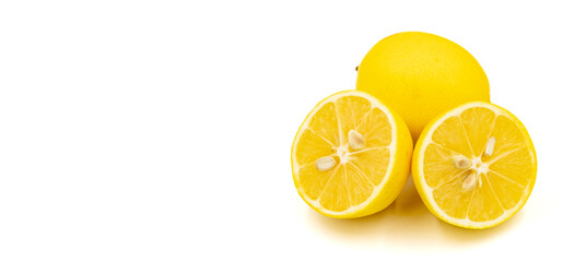 Organic lemon on a white background. Close-up of lemon cut in half. Empty space for text. Copy space