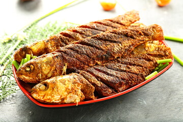 Kerala fish fry- homemade fried fish in coconut oil with exotic Indian spies and herbs,