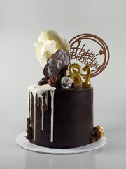 Chocolate cake with white chocolate ganache with custom make chocolate shapes 
