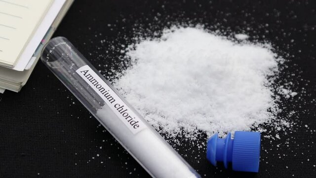 ammonium chloride in test tube and black background