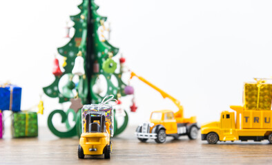 Forklifts, crane, preparation, Decoration Christmas tree  for celebrate the New Year and Christmas with a white background.