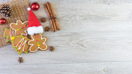 Tasty homemade Christmas cookies on wooden table, gingerbread cookies on dark wood background with copy space for text. holiday, celebration and cooking concept. closeup view