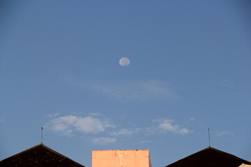 Fototapeta na wymiar moon over the roof