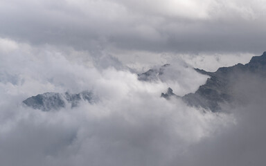 Naklejka na ściany i meble clouds over the mountains, Italian Alps
