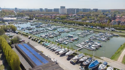Keuken spatwand met foto Antwerp yacht club at Antwerp marina. Boats and yachts with Linkeroever town in the background. Drone aerial view from above © Tom