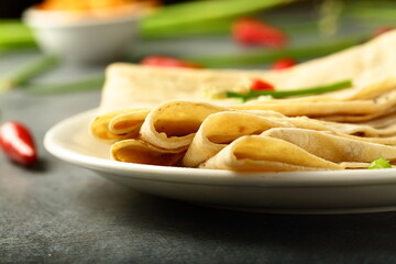 Fresh made Indian flat bread whole wheat chapattis. vegan diet meal.