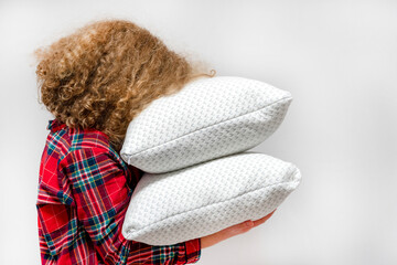 Fototapeta na wymiar girl with pillows. beautiful girl in the bedroom. girl with pillows in room. face in pillows