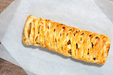 Baked braided pigtails with fruits. pigtail of dough. Fruit homemade pie. delicious dried fruit cake sliced.  dried fruitcake. Concept cake delicious