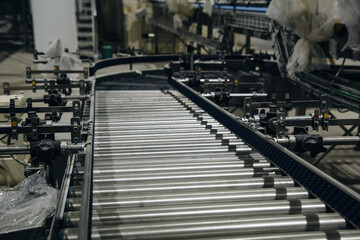 Naklejka na ściany i meble Crossing of the roller conveyor, Production line conveyor roller