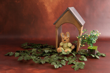 Fototapeta na wymiar bunny in his wooden prop house