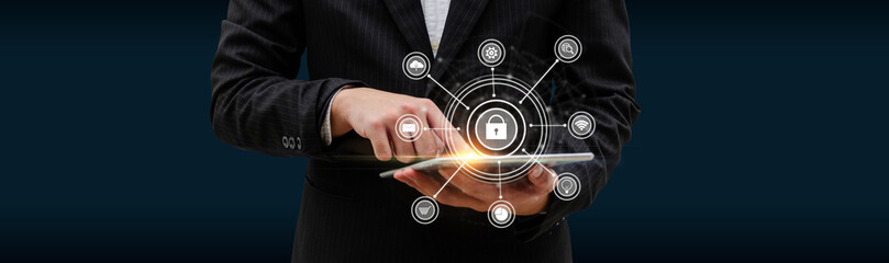 Fototapeta premium business man investor hand touching on digital mobile tablet with virtual graphic icon diagram on dark background, digital marketing, internet connection, business finance, network technology concept