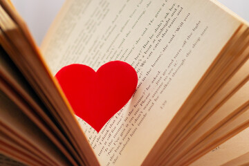 heart shape among the pages in the book. Saint Petersburg, May 20, 2021