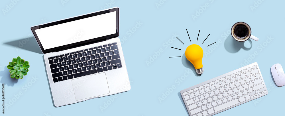 Poster computers with a light bulb from above
