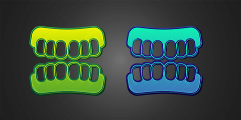 Green and blue Dentures model icon isolated on black background. Teeth of the upper jaw. Dental concept. Vector © Iryna