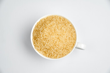 grains of white rice in a white ceramic bowl