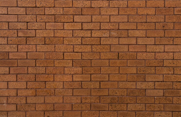 bricks red and broen color arranged in rows on wall