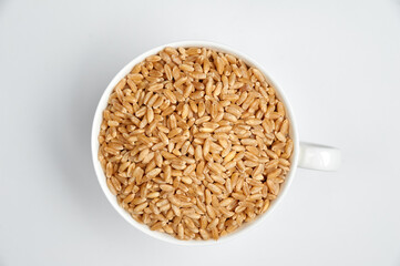 grain of peeled wheat on a white background