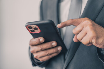 professional person holding smartphone