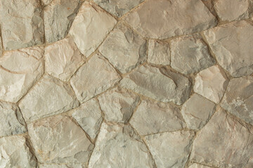 stone wall is arranged in marble, with concrete inserts, stone textures