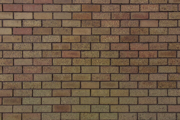 Small bricks red and broen color arranged in rows on the wall