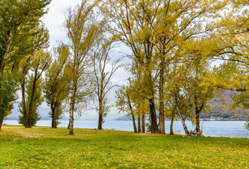 Beach of the Giona Park in Maccagno in the autumn season, Maccagno Inferiore, province of Varese, Italy