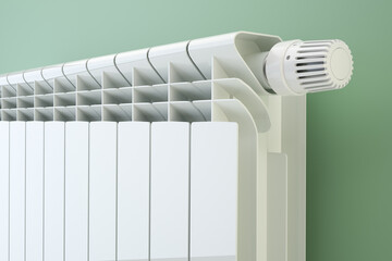 Heater radiator with thermostat on blue wall, 3d illustration - obrazy, fototapety, plakaty
