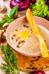Mushroom cream soup with parmesan cheese in beige plate